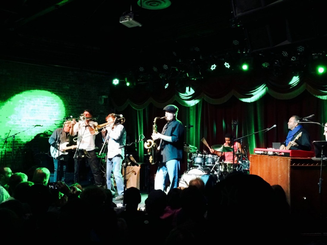 A band performs on stage at an event.