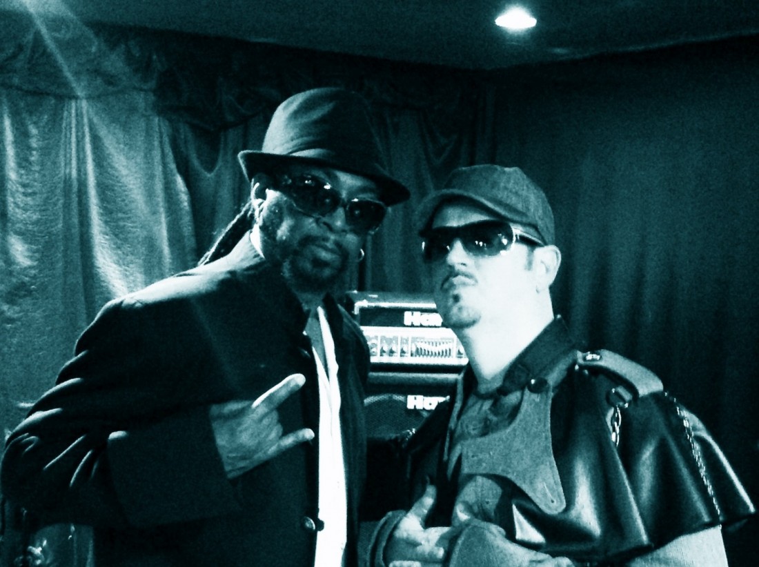 A man and a woman posing for the camera.